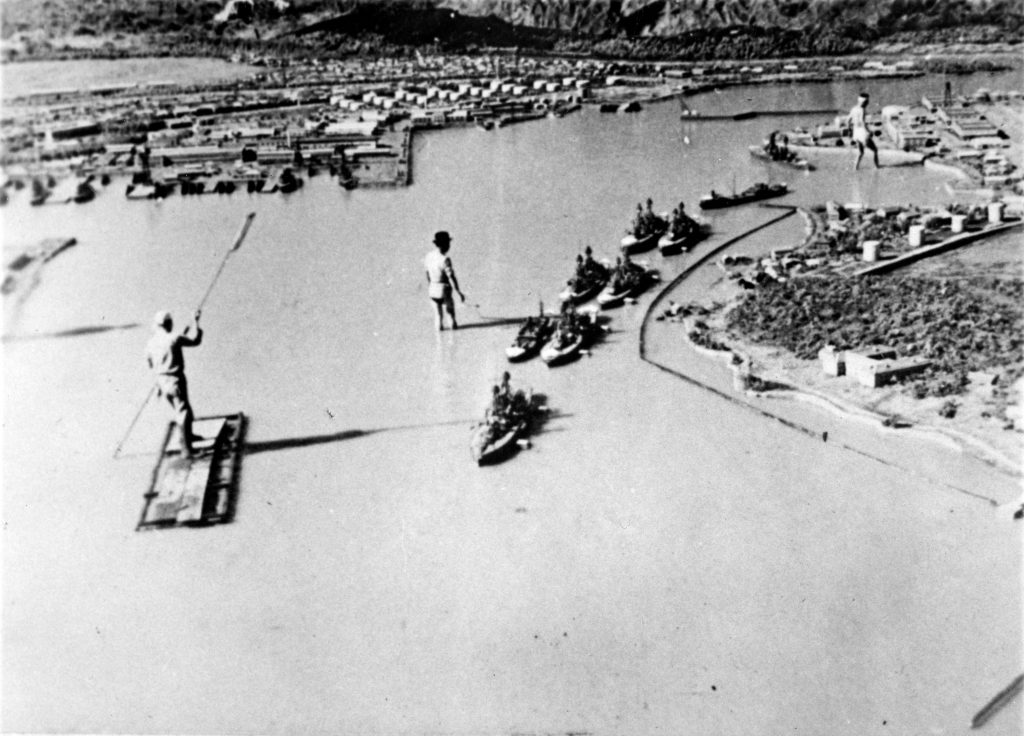 Japanese model of Pearl Harbor, showing ships located as they were during the 7 December 1941 attack. This model was constructed after the attack for use in making a motion picture. The original photograph was brought back to the U.S. from Japan at the end of World War II by Rear Admiral John Shafroth, USN. Collection of Fleet Admiral Chester W. Nimitz. U.S. Naval History and Heritage Command Photograph.